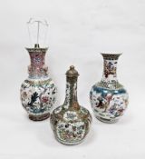 Chinese Canton famille rose bottle vase and cover, 19th century, painted with figures in an interior