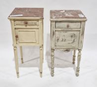 Two late 19th/early 20th century marble-topped pot cupboards, both later cream painted, each with