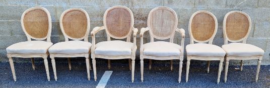Set of six dining chairs in the Louis XVI manner, with limed frames, the oval backs with cane