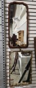 Collection of three mirrors including an early 20th century walnut framed mirror with shaped edge,