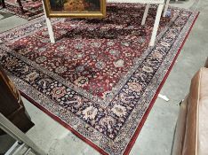 Large floral patterned wool rug with burgundy background in creams and blues, 200cm x 290cm