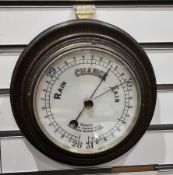 Late 19th / early 20th century circular oak cased wall hanging aneroid barometer with white enamel