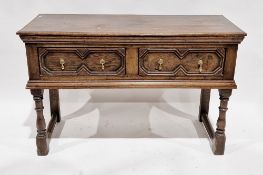 Oak dresser base in the 17th century manner, the single plank top over two geometric moulded drawers