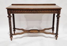 Victorian oak hall table/buffet, the two cushion drawers with gadrooned carving, raised on