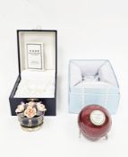 Halcyon Days porcelain and enamel bonbonniere in the form of a cricket ball, inscribed 'Is It