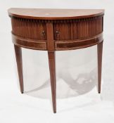 Early 20th century mahogany inlaid demi-lune side cabinet, the frieze with dentil moulded carving