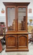 Victorian mahogany library bookcase with moulded cornice over two glazed doors opening to four