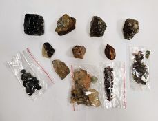 Collection of raw gemstone crystals including corundum, obsidian, agates, quartz, etc