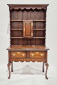 18th century oak dresser, the upper section with moulded cornice and shaped frieze and sides,