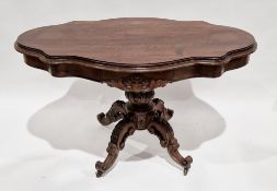 Victorian centre table, the shaped top with moulded edge, raised on a heavily carved bulbous