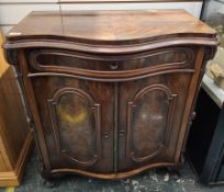 Late 19th/early 20th century mahogany side cabinet of serpentine form, the quarter veneered top with