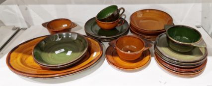 LOT WITHDRAWN Group of French (St Clement) ochre and green glazed pottery including dinner plates,