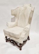 Cream upholstered armchair in the 17th century William and Mary style, raised on a carved walnut