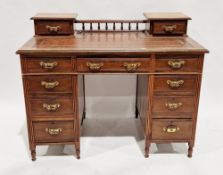 Victorian mahogany kneehole twin pedestal desk, the upper section with two drawers and a spindled