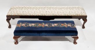 Two early 20th century long stools, the first with floral woolwork panel seat, raised on short