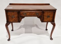 1920's walnut and burr walnut dressing/writing table of inverted serpentine form, the three burr
