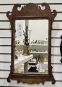 Walnut and parcel gilt fretwork framed mirror in the George III manner, 78cm x 43cm and a mahogany