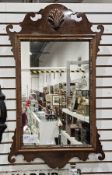 Mahogany and parcel gilt fretwork framed mirror in the George III manner, with moulded shell