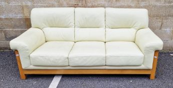 Modern three-seater cream leather upholstered sofa with a pale beechwood frame, 210cm long x 88cm