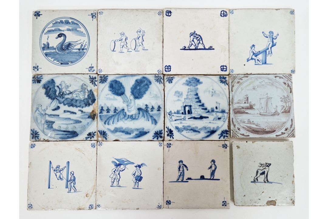 Group of 18th century Dutch Delft tiles, comprising: an example painted with a swan within