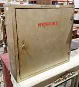 Mid-century industrial hanging medicine cabinet by Bristol Maid, the single door opening to two