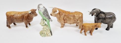 Two Beswick pottery models of Highland cattle, a calf, an elephant and a model of a green budgie
