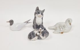 Three Royal Copenhagen porcelain figures of animals including a model of a kitten playing with its