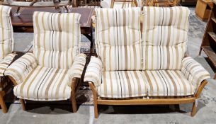 Ercol Saville light elm framed matching two-seater sofa, model 9302 and armchair, model 930, each