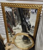 19th century oval mirror, the gilt frame with moulded ivy leaf cresting and acanthus leaf edge, 55cm