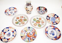 Group of Japanese Imari porcelain, including: an oviform Arita vase painted with flowering