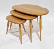 Nest of three Ercol pale elm and beech pebble tables, model no.354, largest 64cm long x 41cm high