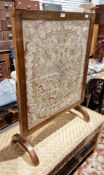 Early 20th century oak framed metamorphic table/firescreen inset with a silk and metallic thread