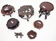 Group of early 20th century and later Chinese carved hardwood stands, including a small carved