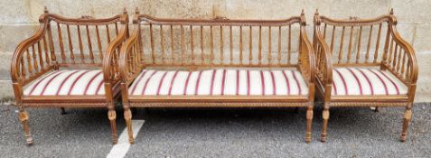 Walnut settee and two matching armchairs in the Louis XVI manner, each piece with top rails having