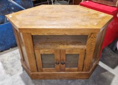Oak corner television cabinet, panelled construction with open shelf above two glazed doors, 95cm