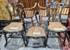 Pair of 19th century black lacquered bedroom chairs with mother-of-pearl inlay and cane seats,