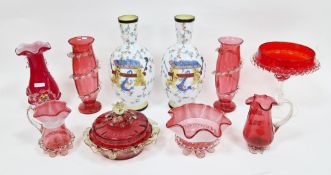 Collection of Victorian and later cranberry tinted glassware, including spill and posy vases, with