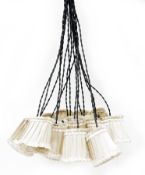 Contemporary multi-strand pendant light fitting retailed by ABC store in New York comprising sixteen