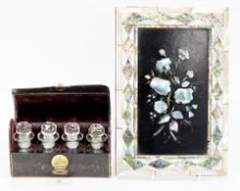 Victorian tooled leather cased four-glass scent bottle set with stoppers, 14cm wide and a