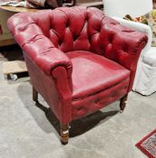 Late 19th/early 20th century club-type armchair with red leather effect, button back upholstery