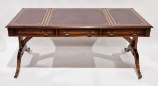 Bevan Funnell Reprodux mahogany writing desk, the top with three burgundy leather inset panels