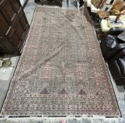 Iranian large four-panelled floral rug (old with some wear and tear), 270cm x 460cm