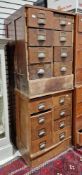 Two early 20th century mahogany banks of eight short drawers, each drawer with brass index holder