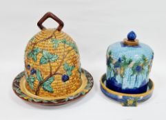 Two Minton-style majolica cheese domes and stands, the first basket moulded and moulded in relief