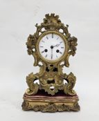 19th century French gilt brass mantel clock, the case of waisted form cast with rococo foliate