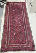 Red Iranian hand knotted runner in red, brown and cream diamond design with green on red and blue,