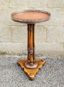 Theodore Alexander Louis XVI style circular lamp table, the circular leather inset top with