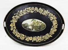Victorian black painted tole oval two-handled tray, painted with a landscape cartouche, within