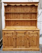 Modern pine dresser, the rack with two shelves over a base with three drawers and three cupboard