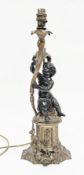 Bronze figural table lamp in the form of a putto holding a foliate scrolling branch and raised on